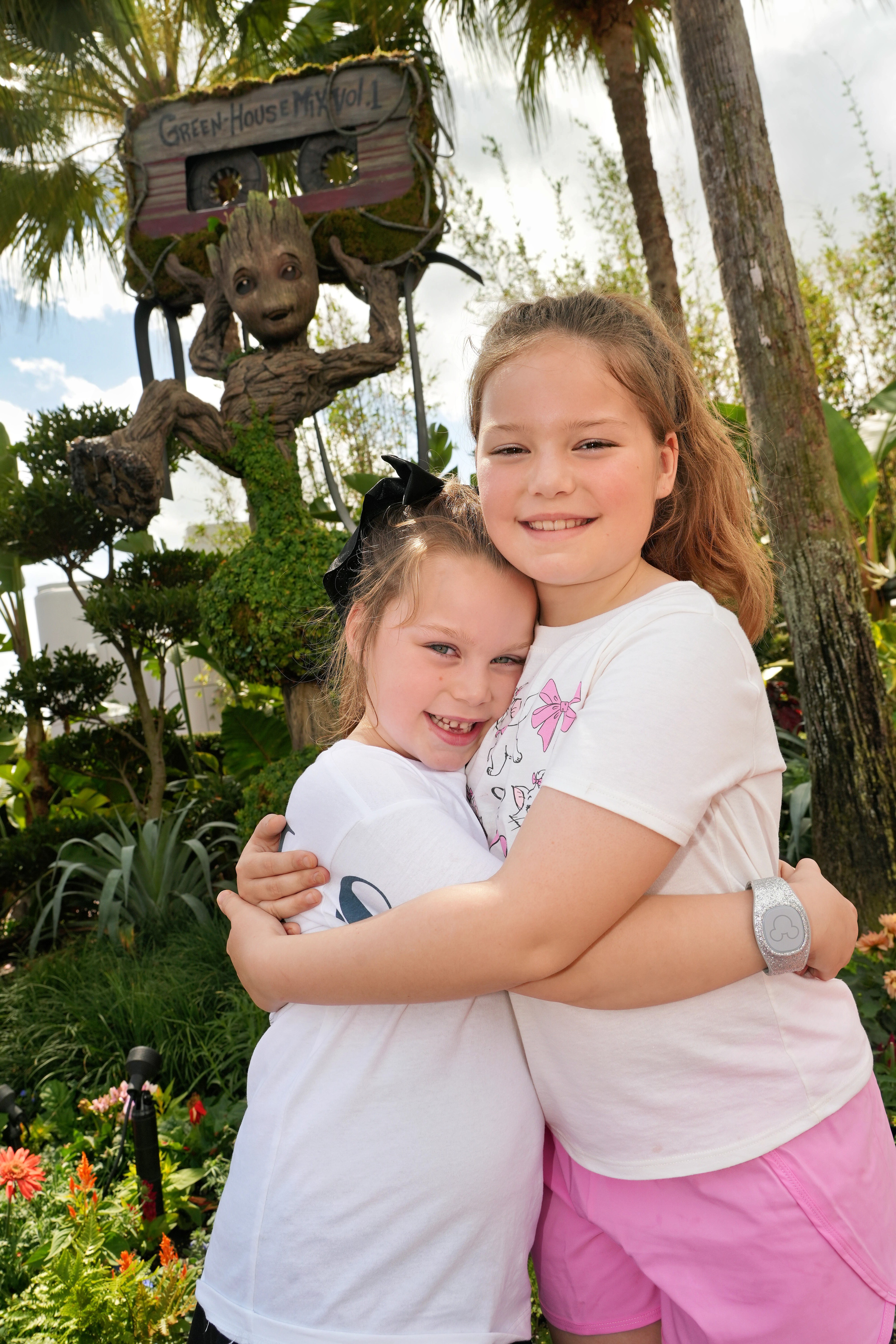 Zoey and Evie hugging at Epcot &mdash; Evie wearing her signature big black bow